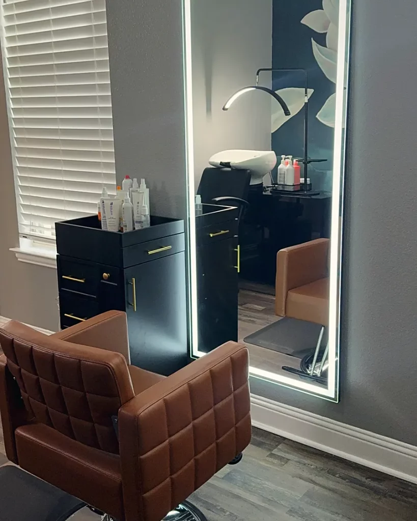 Customer salon with a black HBS Basin reflected in a lit mirror